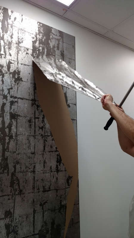 Wallpaper removal expert providing services at a Torrance, CA home.